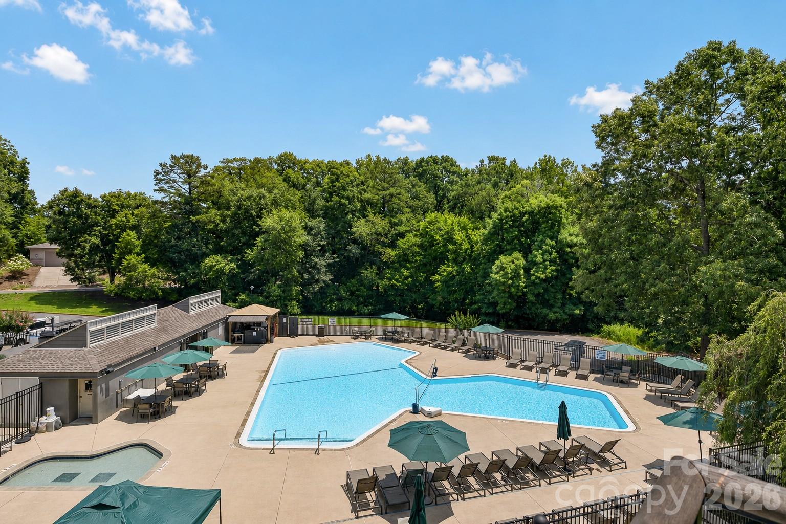 185 Riverview Terrace Clover, SC 29710 - Photo 28 of 35 a view of a swimming pool with a patio and fire pit