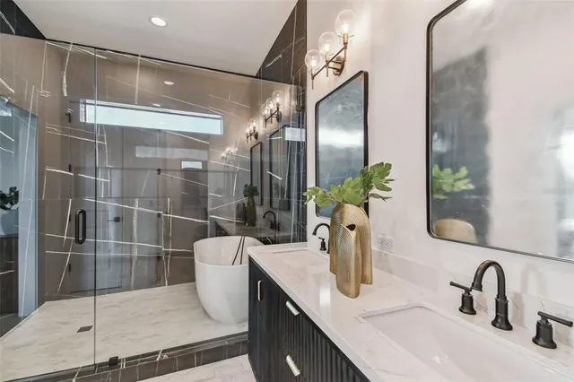 a bathroom with a shower and a sink