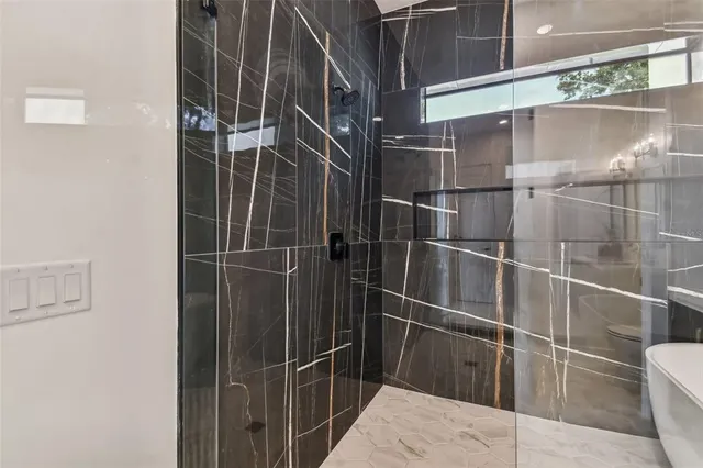 a bathroom with a bathtub and a sink