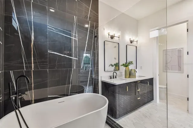 a bathroom with a double vanity sink and a mirror