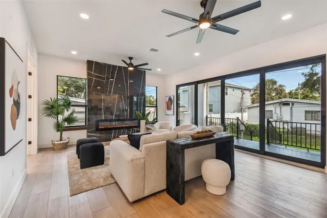 a living room with furniture and a large window