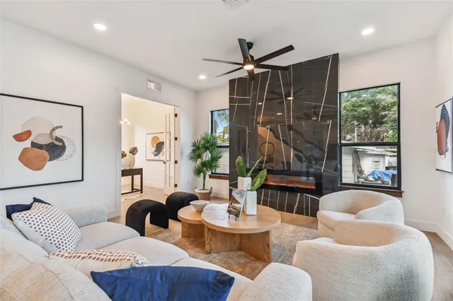 a living room with furniture and a large window