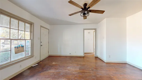 a view of an empty room with a window