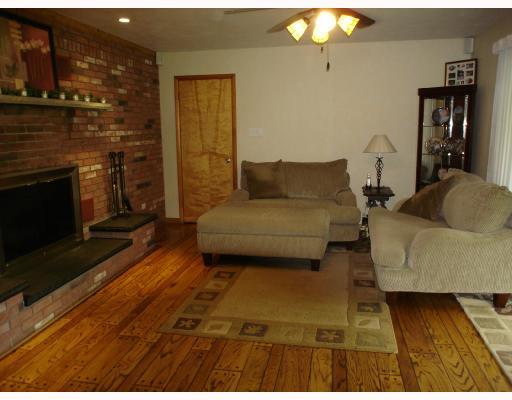 163 Taylor Road West Newton, PA 15089 - Photo 3 of 8 Den/Family/Great Room. Refinished hard wood plank flooring and log burning fireplace offer a rcozy retreat!