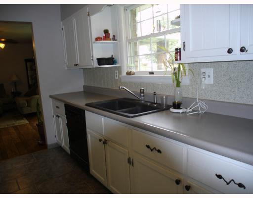 163 Taylor Road West Newton, PA 15089 - Photo 7 of 8 Kitchen. New counter tops, sink and ceramic floor update the kitchen