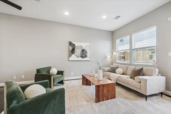 a living room with furniture and a window