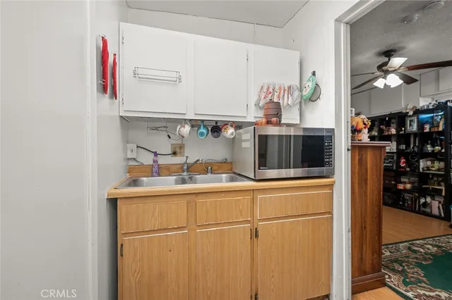 a kitchen with stainless steel appliances a refrigerator and a stove top oven