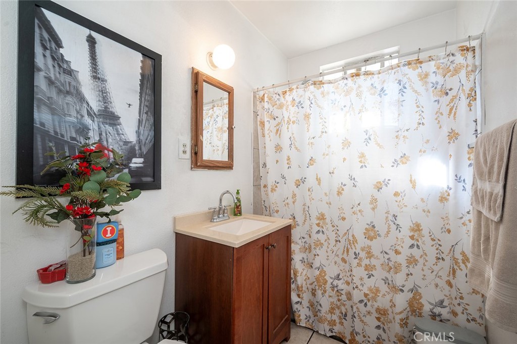 5355 Cogswell Road El Monte, CA 91732 - Photo 14 of 33 a bathroom with a sink toilet and shower