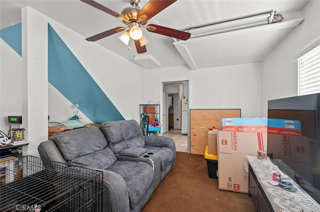 5355 Cogswell Road El Monte, CA 91732 - Photo 16 of 33 a living room with furniture and a chandelier