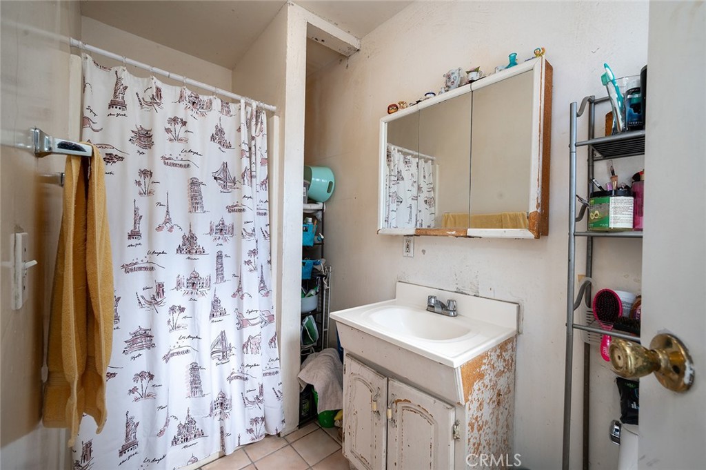 5355 Cogswell Road El Monte, CA 91732 - Photo 21 of 33 a bathroom with a sink toilet and vanity