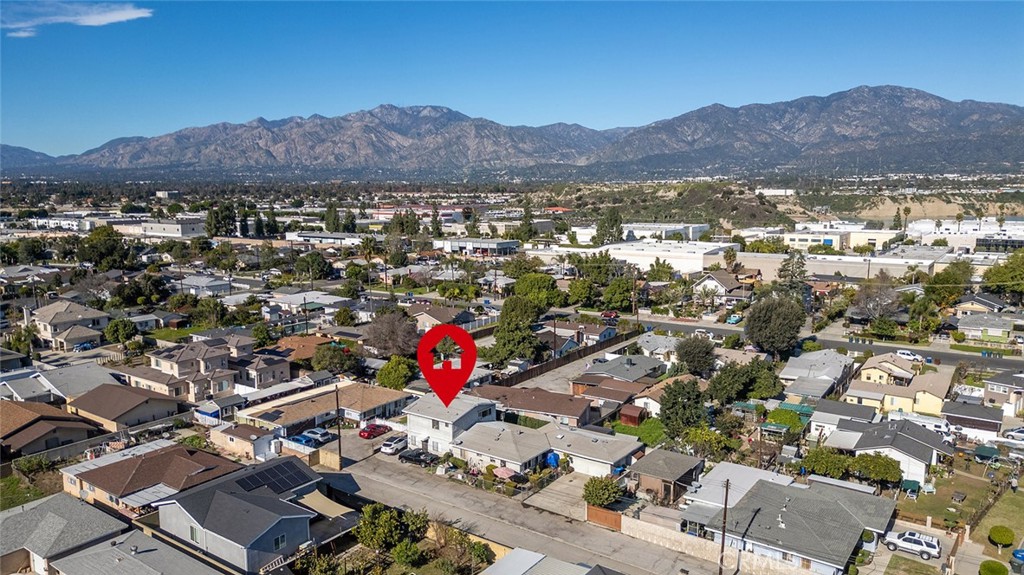 5355 Cogswell Road El Monte, CA 91732 - Photo 28 of 33 an aerial view of a city with lots of residential buildings and mountain view in back