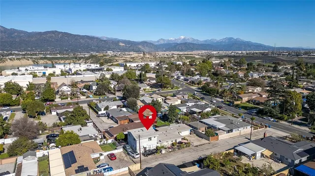 an aerial view of residential houses and outdoor space