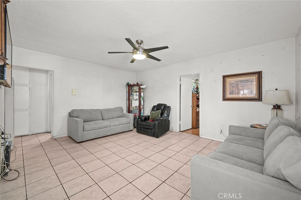 5355 Cogswell Road El Monte, CA 91732 - Photo 5 of 33 a living room with furniture and a chandelier