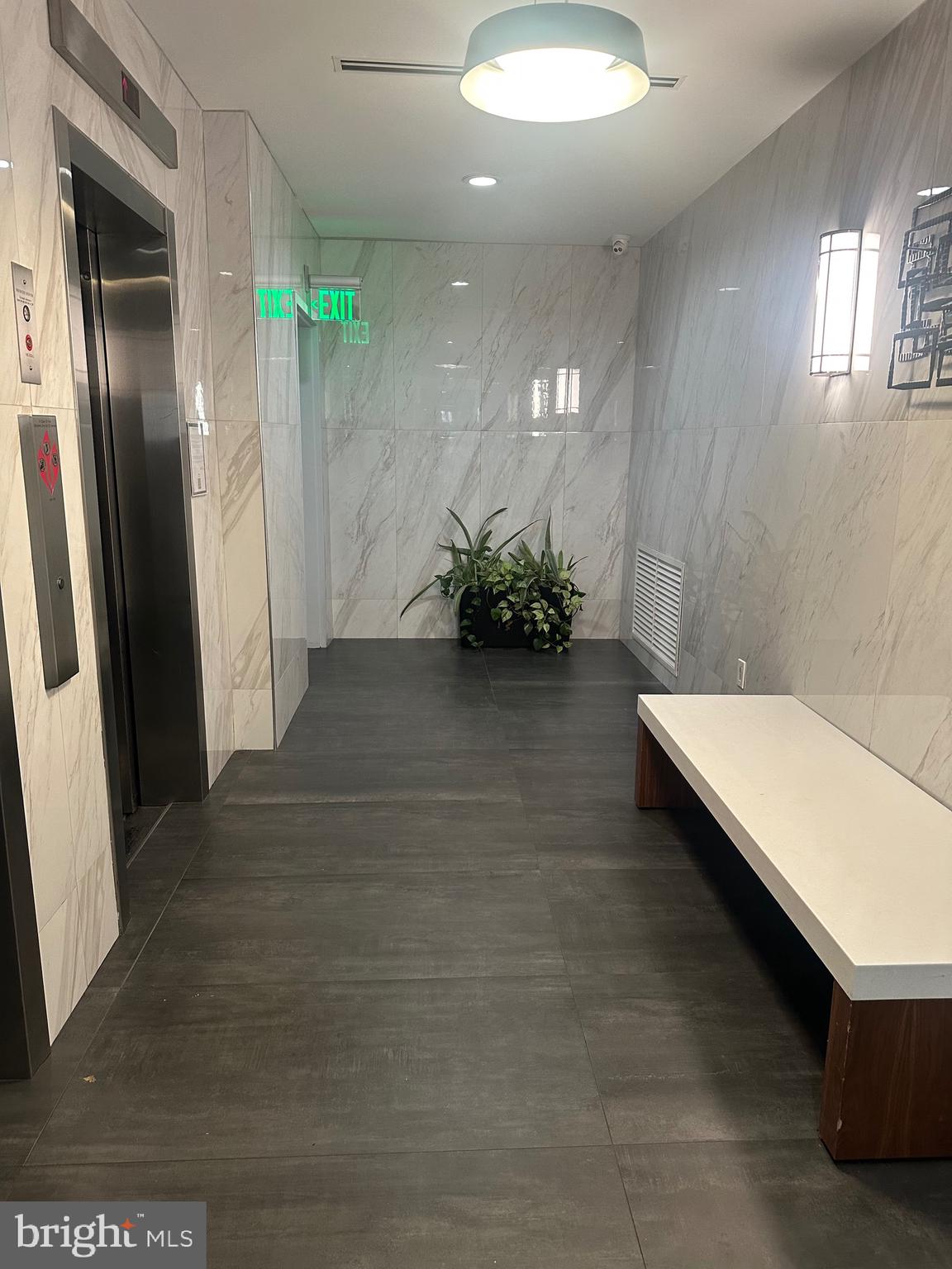 2101-17 Chestnut Street, Unit 424 Philadelphia, PA 19103 - Photo 2 of 14 view of a room with floor to ceiling window and stairs