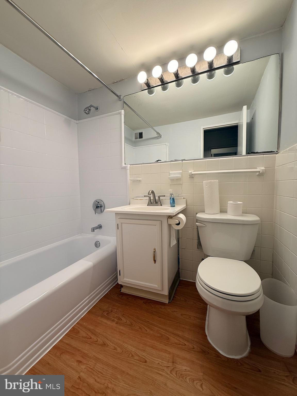 2101-17 Chestnut Street, Unit 424 Philadelphia, PA 19103 - Photo 10 of 14 a bathroom with a sink a toilet and bathtub