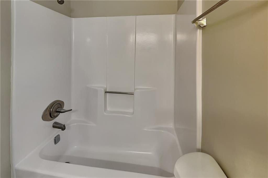 335 Olde Bridge Way Johns Creek, GA 30022 - Photo 15 of 19 a bathroom with a tub and a shower