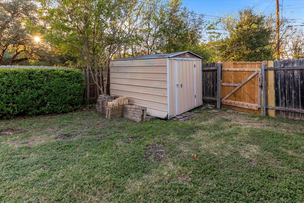 1812 Trinity Drive Waco, TX 76710 - Photo 21 of 24 View of shed featuring a gate and a fenced backyard