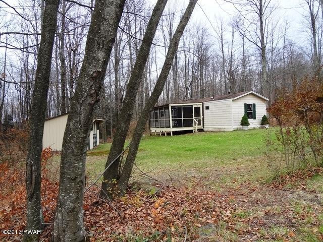69 Salem Heights Rd Lake Lake Ariel, PA 18436 - Photo 3 of 18 a view of a house with backyard and tree