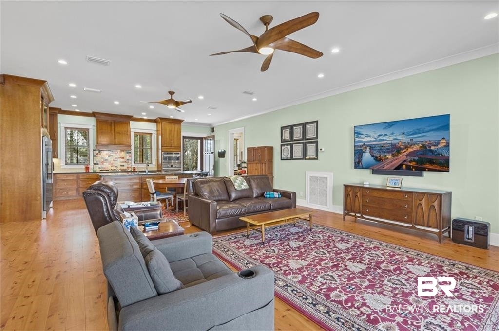 2730 Gator Road Mobile, AL 36605 - Photo 8 of 42 Living room featuring ornamental molding, light wood-style floors, a ceiling fan, and recessed lighting