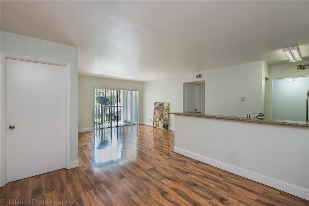 560 South Park Road, Unit 247 Hollywood, FL 33021 - Photo 3 of 21 wooden floor in an empty room with a window