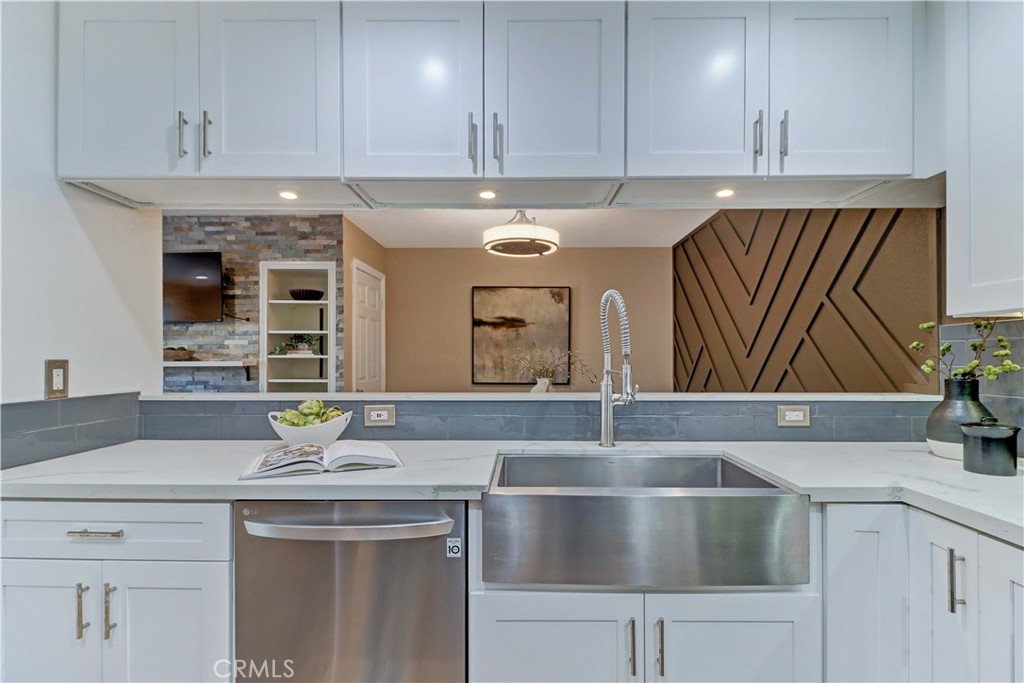 3605 East Anaheim Street, Unit 102 Long Beach, CA 90804 - Photo 13 of 37 a kitchen with a sink and cabinets