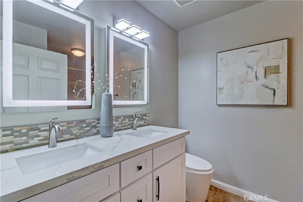 3605 East Anaheim Street, Unit 102 Long Beach, CA 90804 - Photo 20 of 37 a bathroom with a sink and a mirror