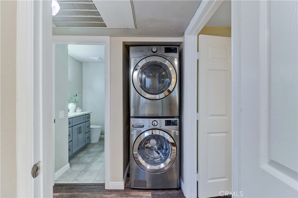 3605 East Anaheim Street, Unit 102 Long Beach, CA 90804 - Photo 27 of 37 a utility room with sink dryer and washer