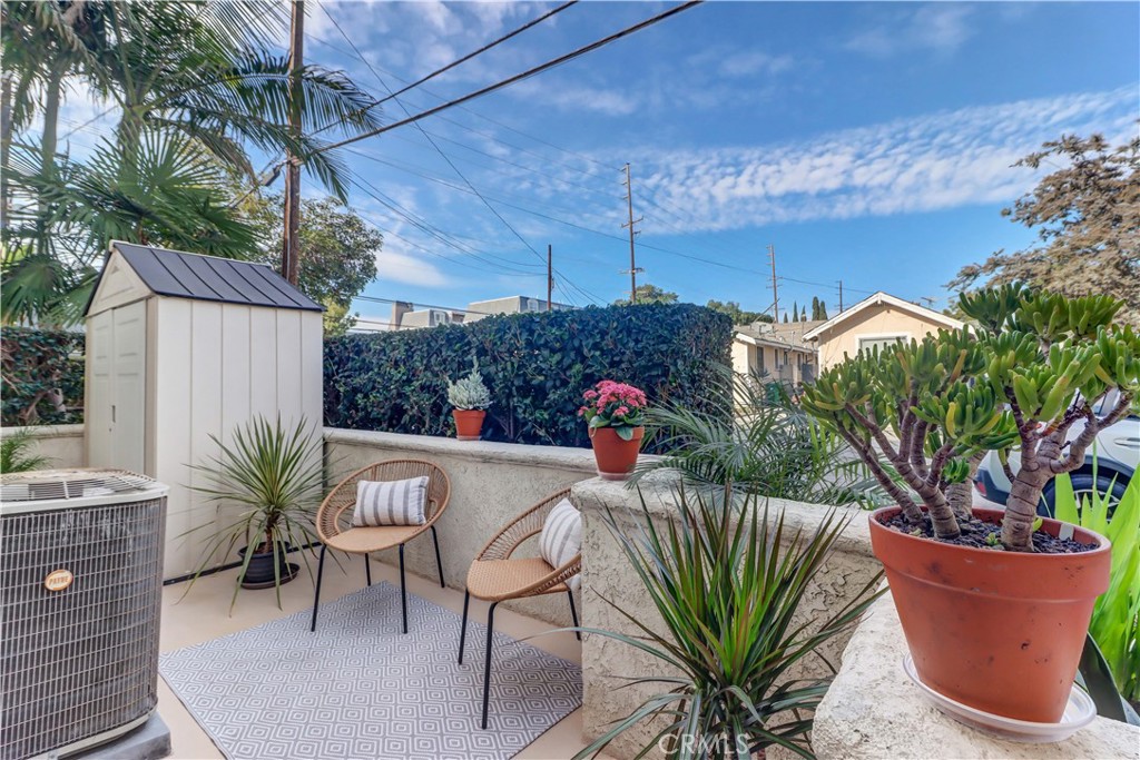 3605 East Anaheim Street, Unit 102 Long Beach, CA 90804 - Photo 33 of 37 a view of a chairs and table in patio