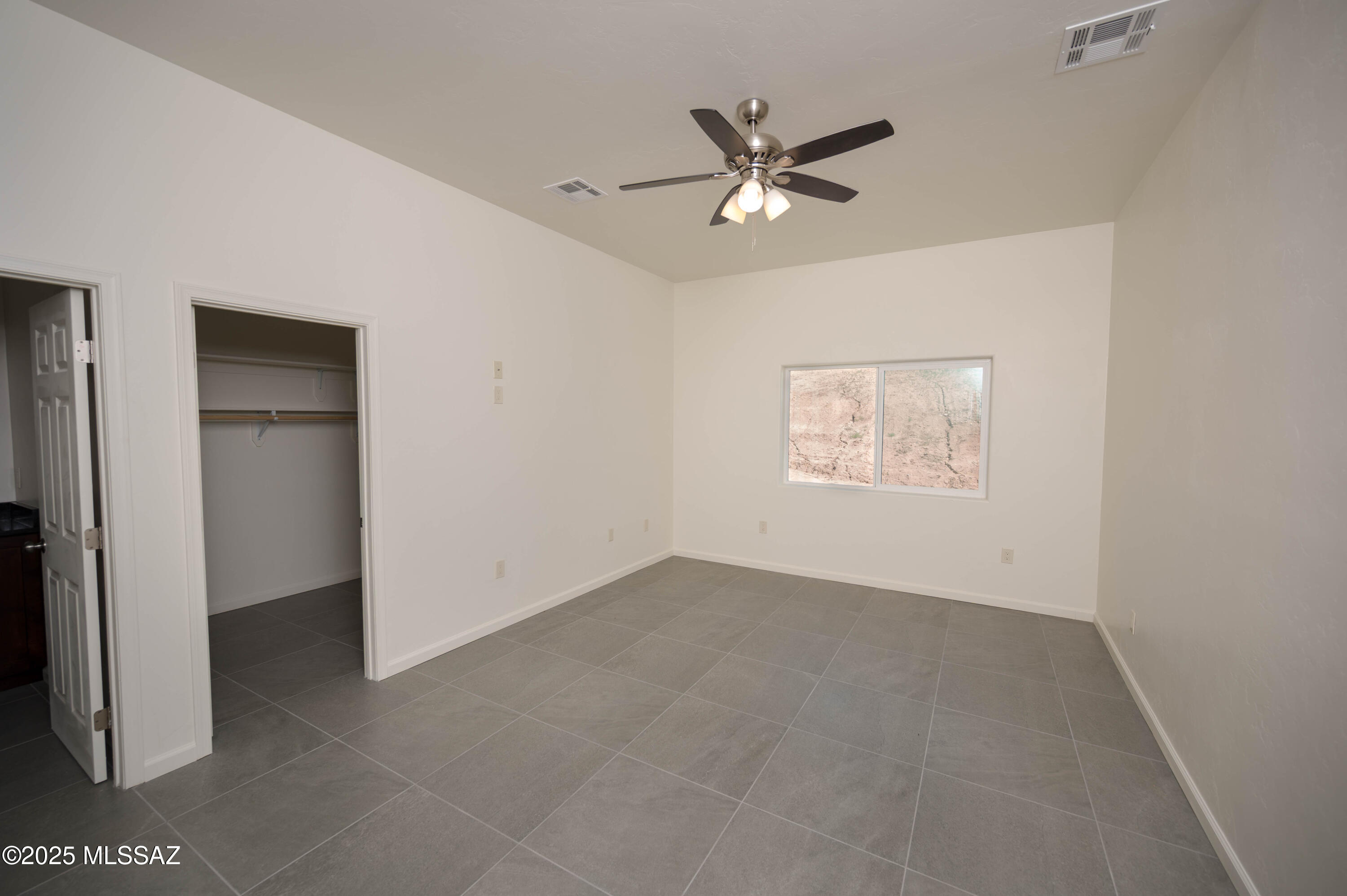 280 Donna Court Rio Rico, AZ 85648 - Photo 38 of 50 a view of an empty room with a window