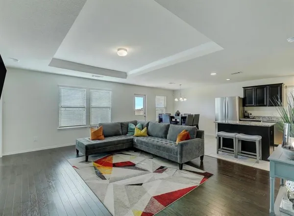 a living room with fireplace furniture and a flat screen tv
