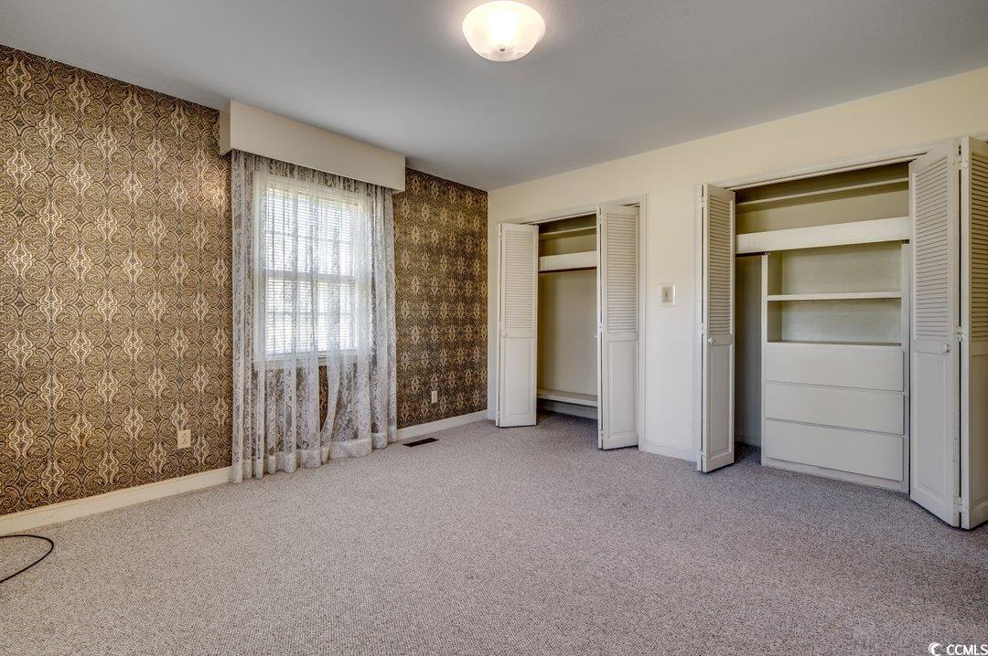 2837 Long Ave Extension Conway, SC 29526 - Photo 19 of 39 Unfurnished bedroom with carpet and two closets