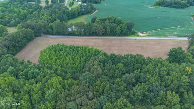 a view of a street with a park