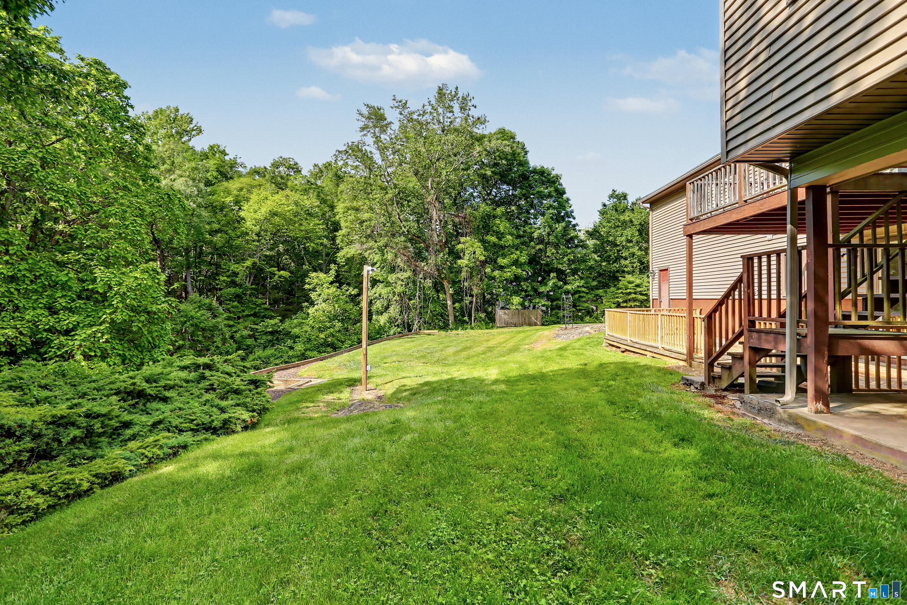 632 Wheelers Farm Road Orange, CT 06477 - Photo 33 of 39 a view of a house with a yard