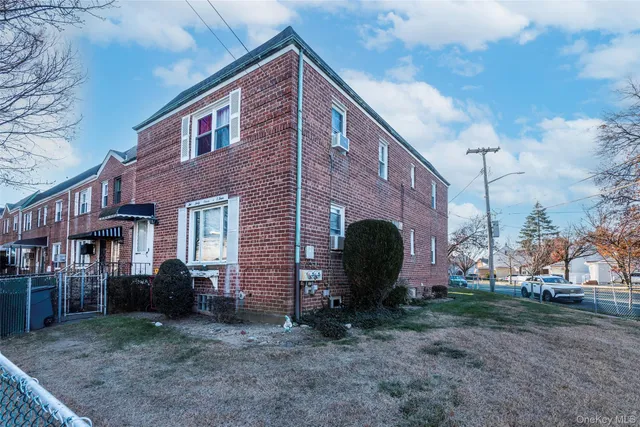 a view of house with a backyard