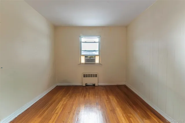 wooden floor and window in an empty room