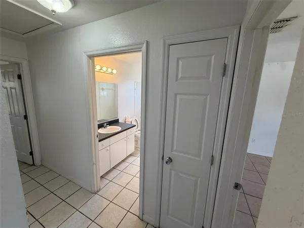 a kitchen with a refrigerator and window