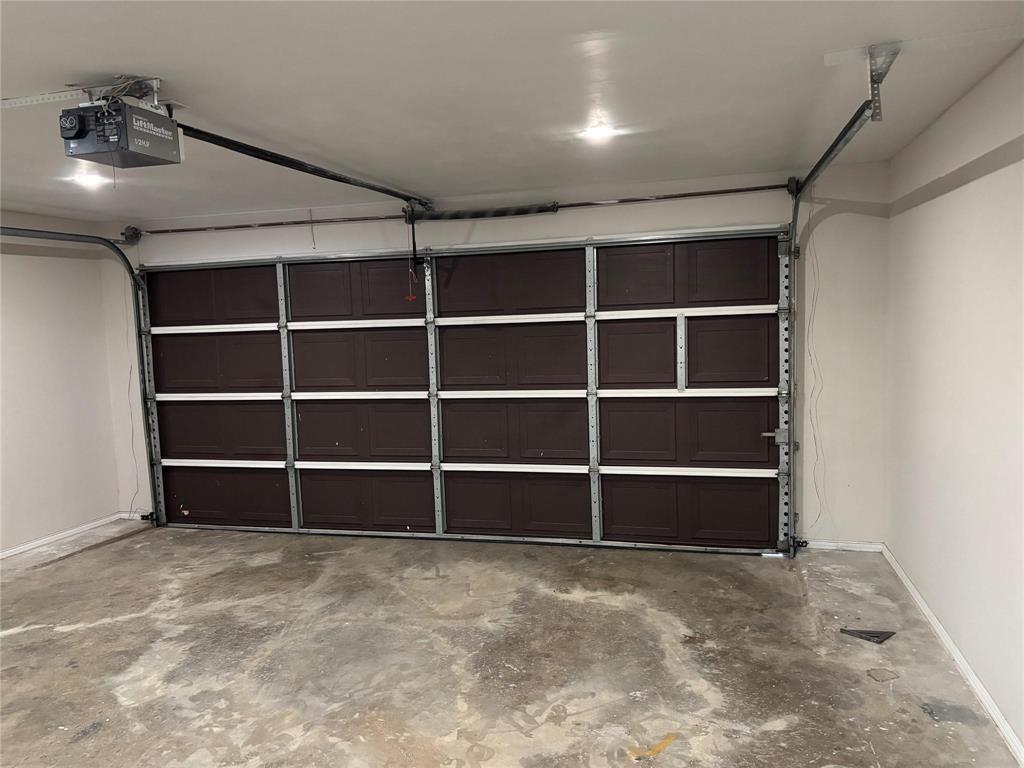 8455 Sugarberry Road Dallas, TX 75249 - Photo 17 of 18 a view of an empty room with empty shelves
