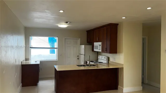 a room with a sink and a window