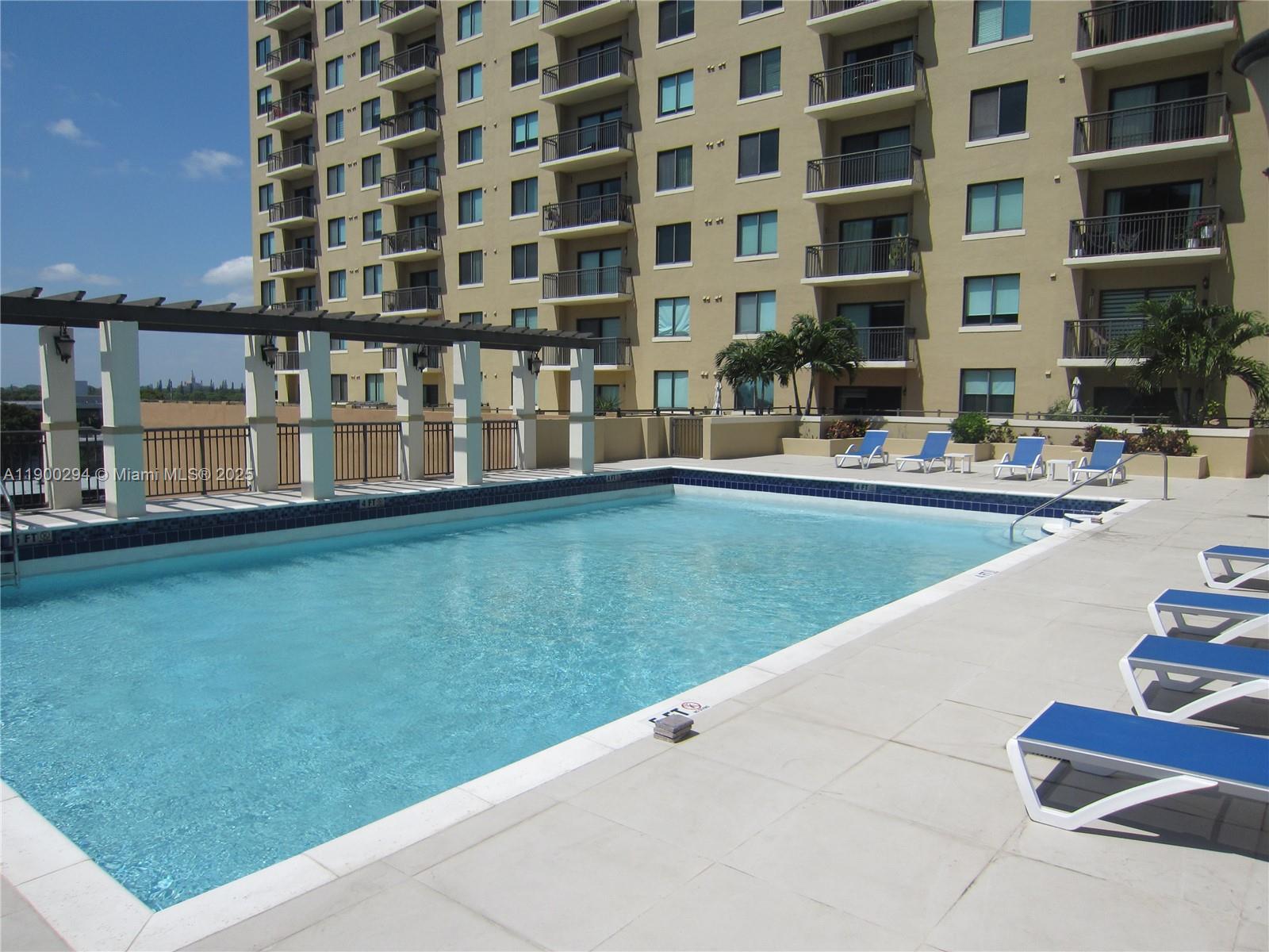 4242 Northwest 2nd Street, Unit 1613 Miami, FL 33126 - Photo 18 of 30 a view of building with yard