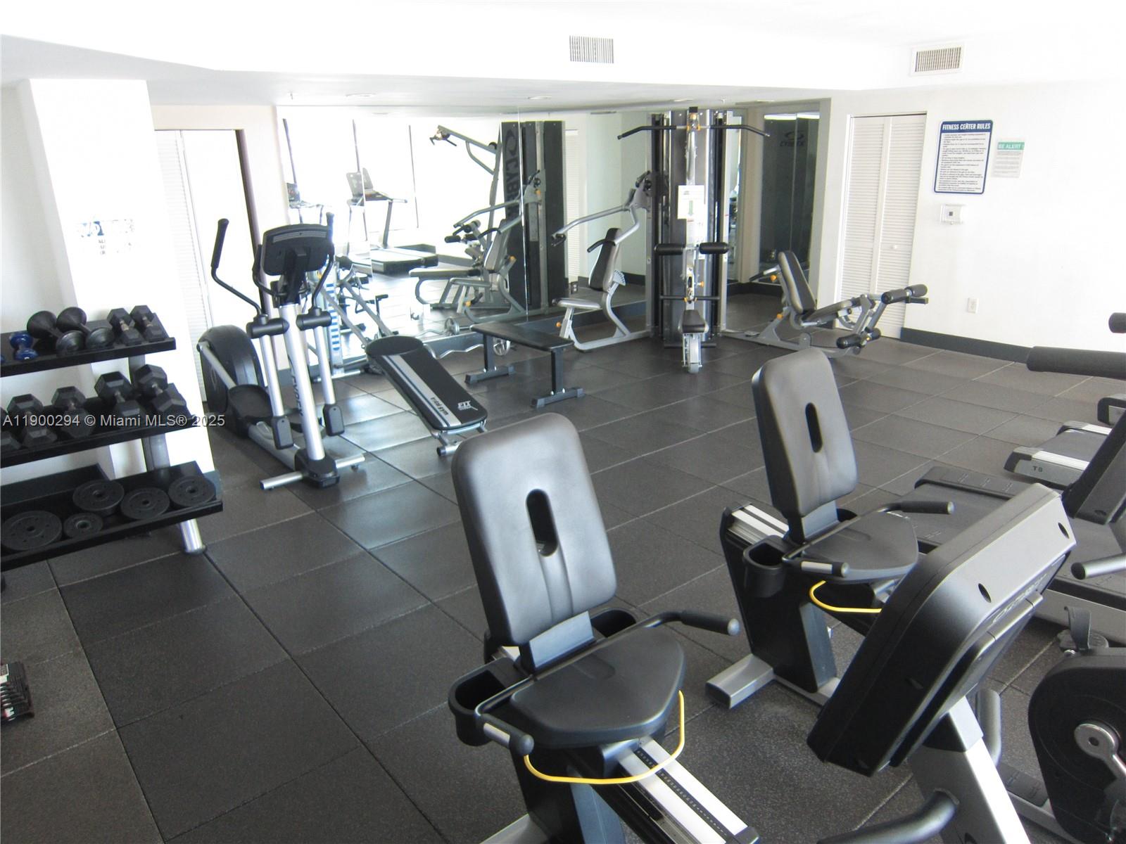 4242 Northwest 2nd Street, Unit 1613 Miami, FL 33126 - Photo 20 of 30 a view of a workspace with furniture and a window