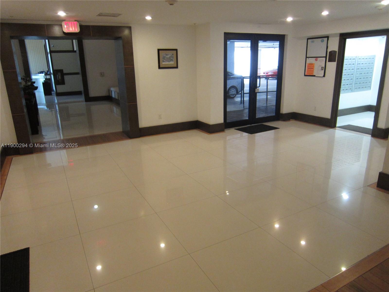 4242 Northwest 2nd Street, Unit 1613 Miami, FL 33126 - Photo 26 of 30 a view of an empty room with glass door and a window