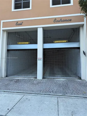 a view of a house with a yard and a garden