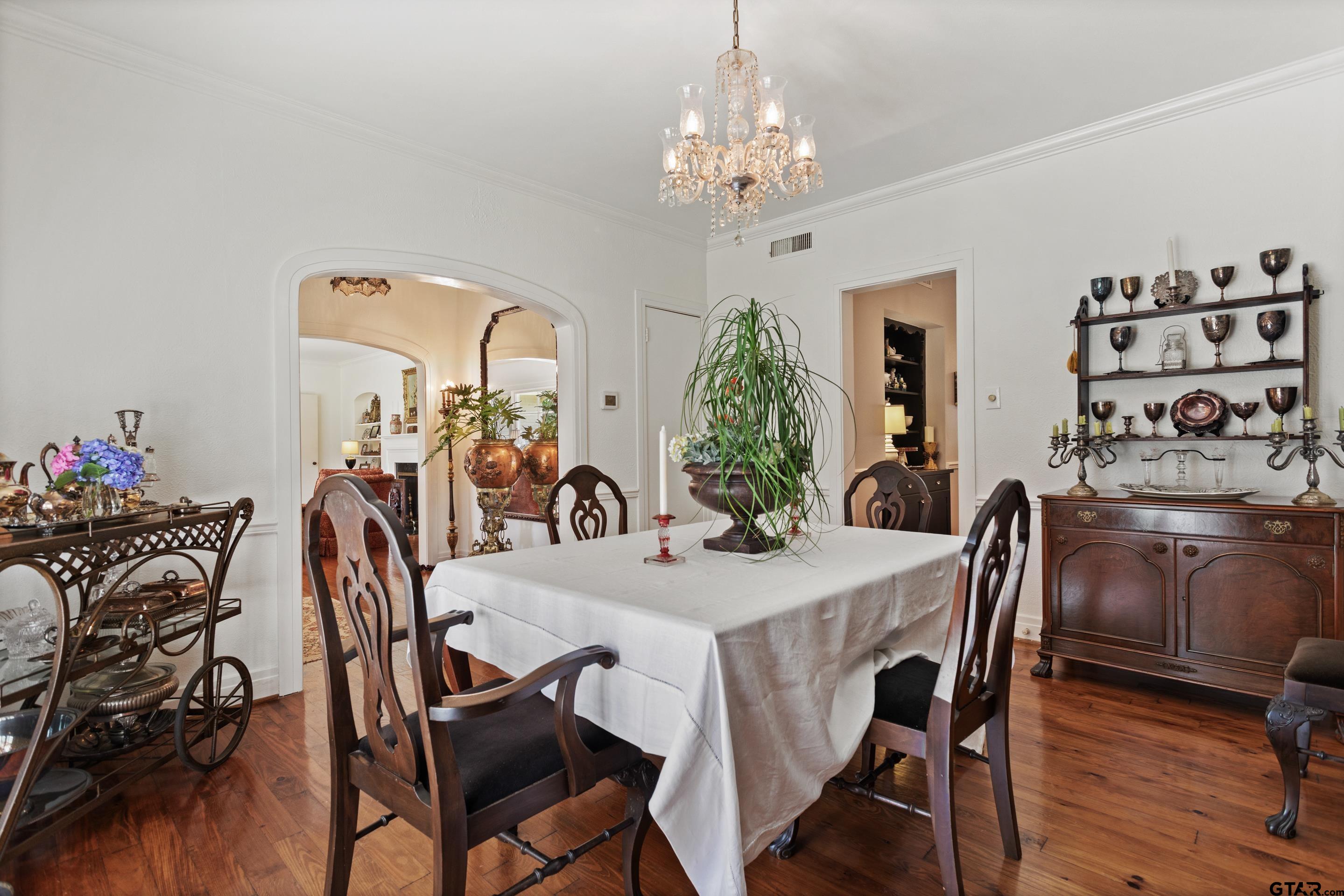 2631 Old Bullard Road Tyler, TX 75701 - Photo 6 of 43 a view of a dining room with furniture and wooden floor