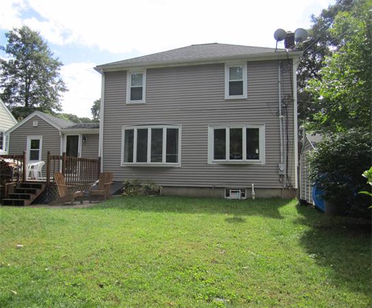 26 Ronaele Road Medford, MA 02155 - Photo 2 of 9 a house that has a big yard in front of it
