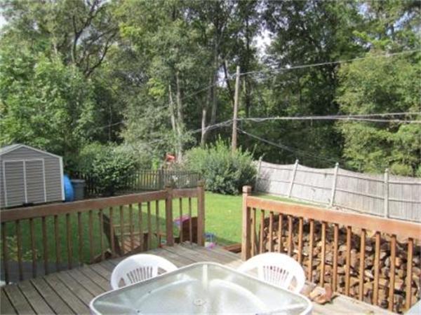 26 Ronaele Road Medford, MA 02155 - Photo 3 of 9 a view of a deck with a chair