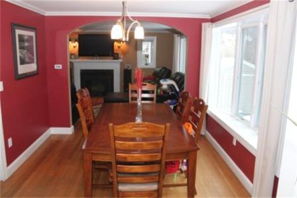 26 Ronaele Road Medford, MA 02155 - Photo 5 of 9 a view of a livingroom with furniture and a fireplace
