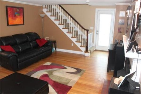 26 Ronaele Road Medford, MA 02155 - Photo 7 of 9 a living room with furniture and a floor to ceiling window