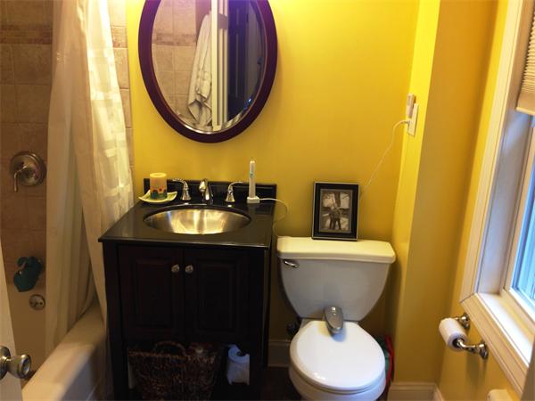 26 Ronaele Road Medford, MA 02155 - Photo 9 of 9 a bathroom with a toilet a sink and a mirror