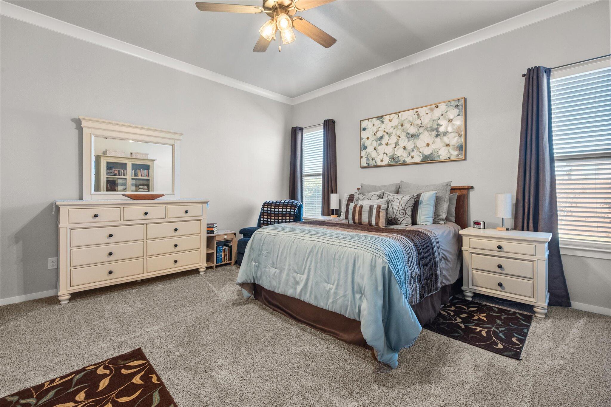 2010 142nd Street Lubbock, TX 79423 - Photo 24 of 33 a bedroom with a bed and a dresser