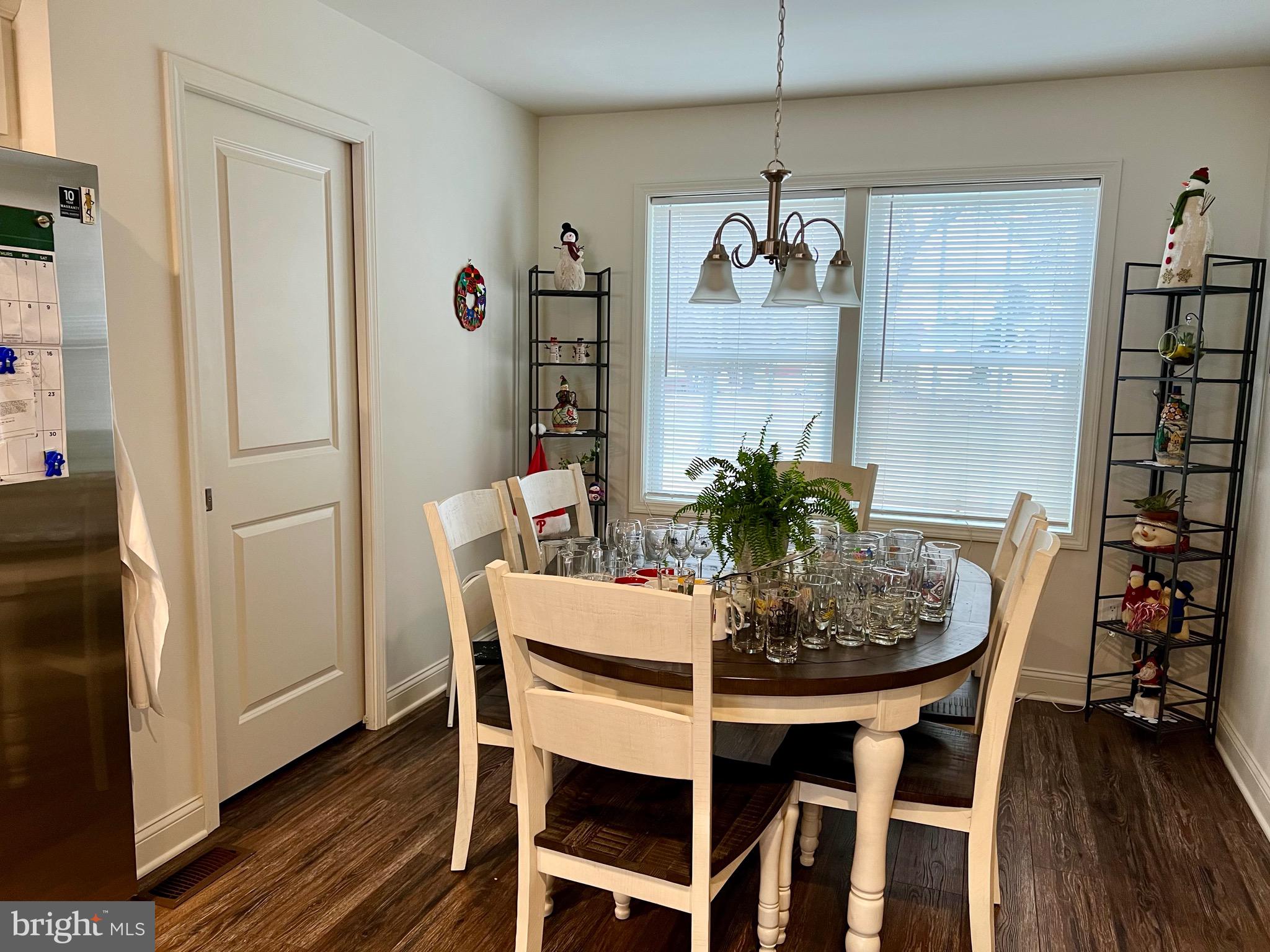 46 West Pittsfield Street Pennsville, NJ 08070 - Photo 8 of 25 a dining room with furniture potted plants and wooden floor
